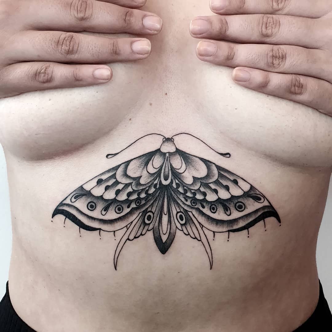 Blackwork moth tattoo in Lisbon