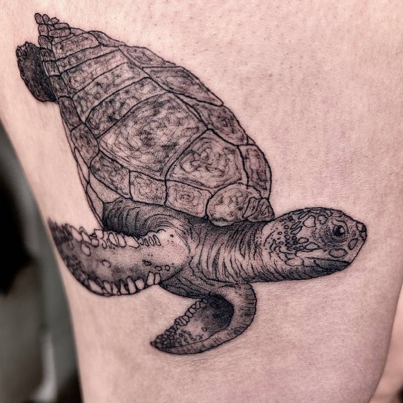 Blackwork turtle thigh tattoo in Lisbon