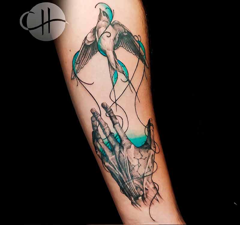 Fine line bird and hand tattoo by Choco in Lisbon