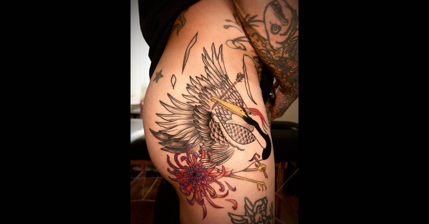 Oriental heron thigh tattoo in Lisbon