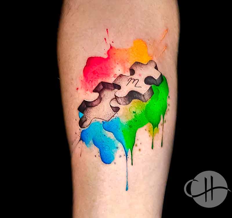 Watercolor puzzle piece tattoo by Choco in Lisbon